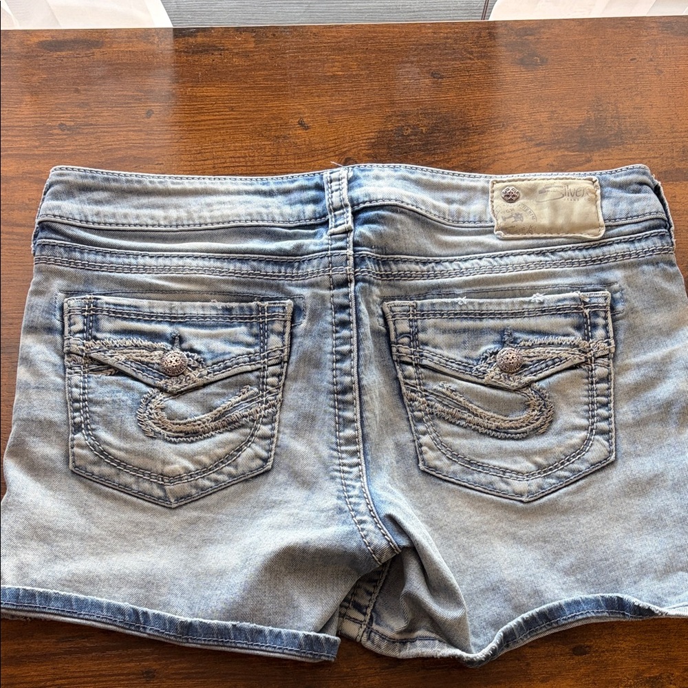 Silver Jeans Light Blue Denim Shorts with Embroidered Patch